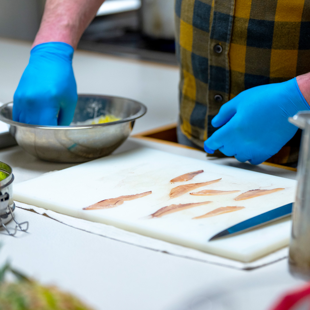 Chefs preparing squid fins during research study at the University of Maine.