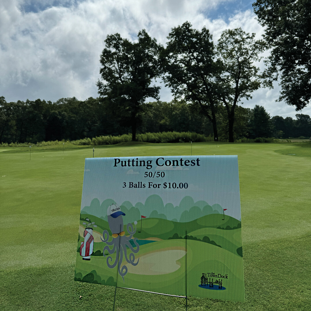 Hero of putting contest sign at the putting hole.