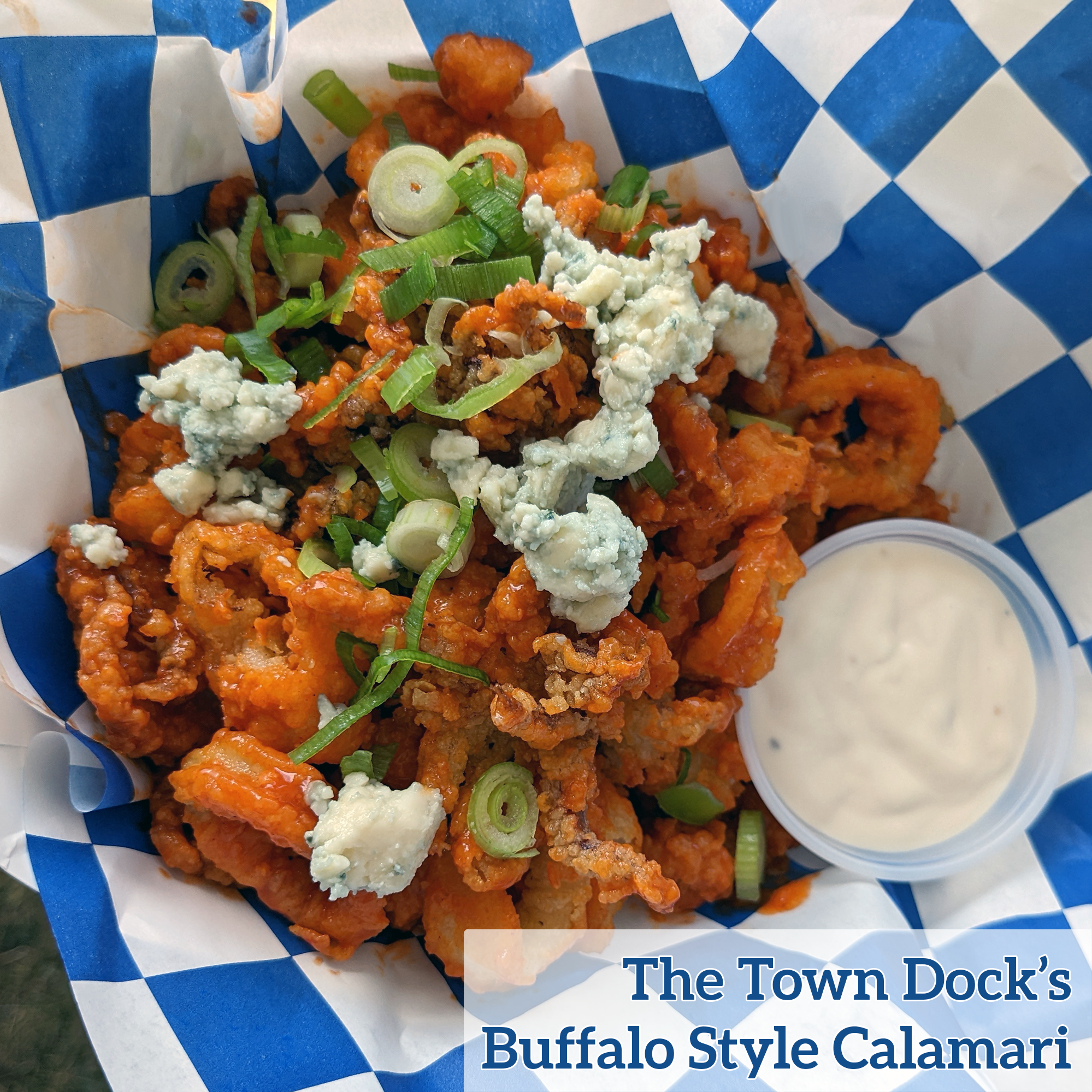 Fried calamari rings and tentacles, tossed in buffalo sauce, topped with blue cheese and scallion